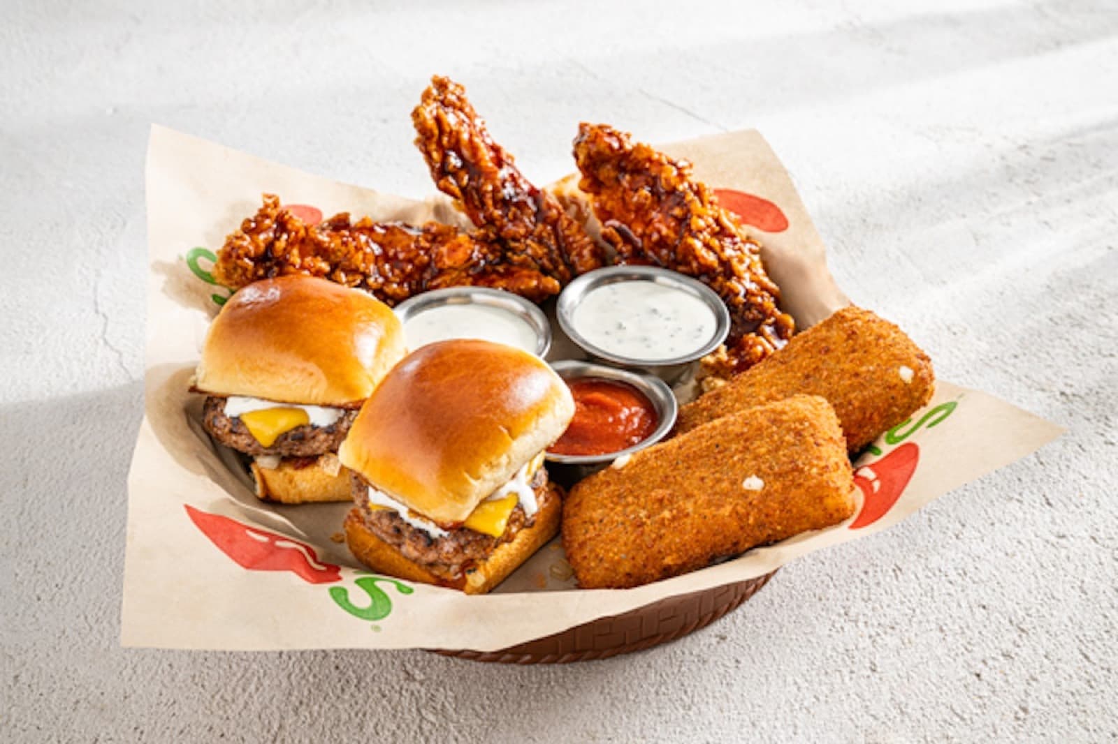 A Chili's Triple Dipper, three appetizers with dipping sauces