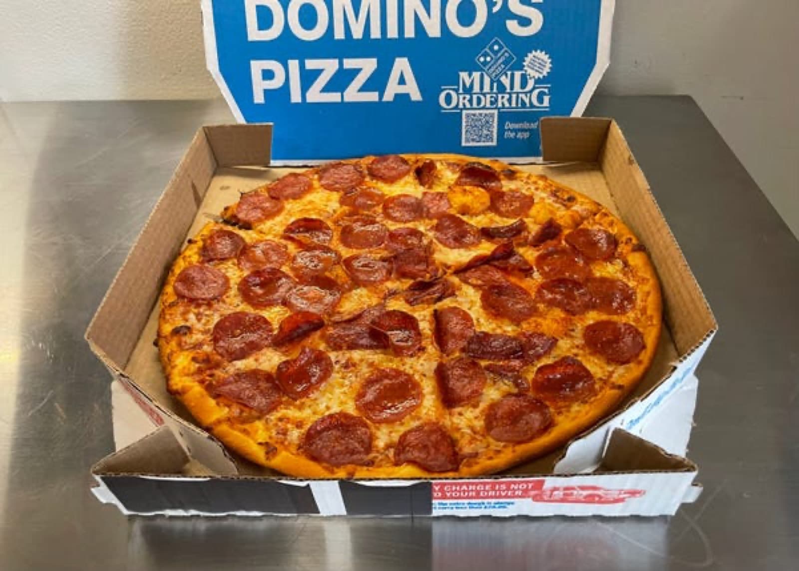 A Domino's pizza, fresh from the box