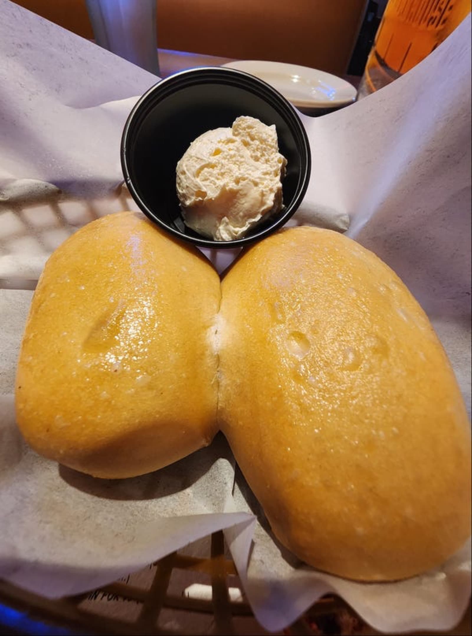 A Logan's Roadhouse steak dinner with fresh-baked rolls
