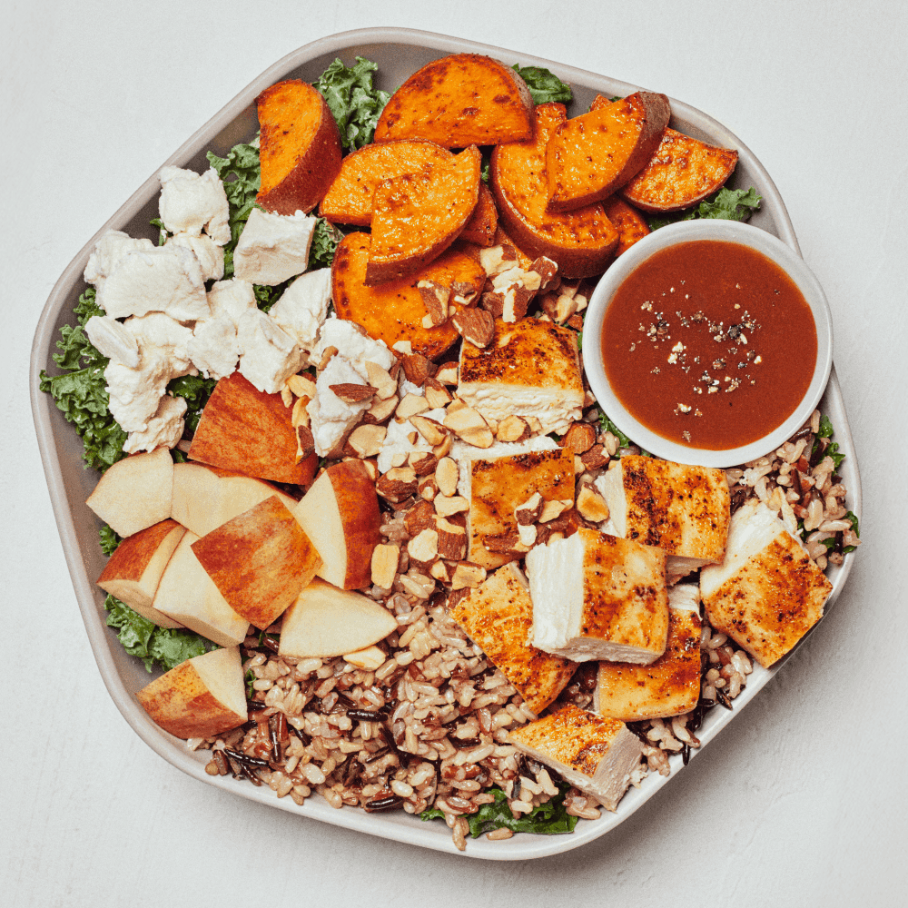 Sweetgreen Harvest Bowl with roasted chicken, sweet potatoes, apple, wild rice, and shredded kale