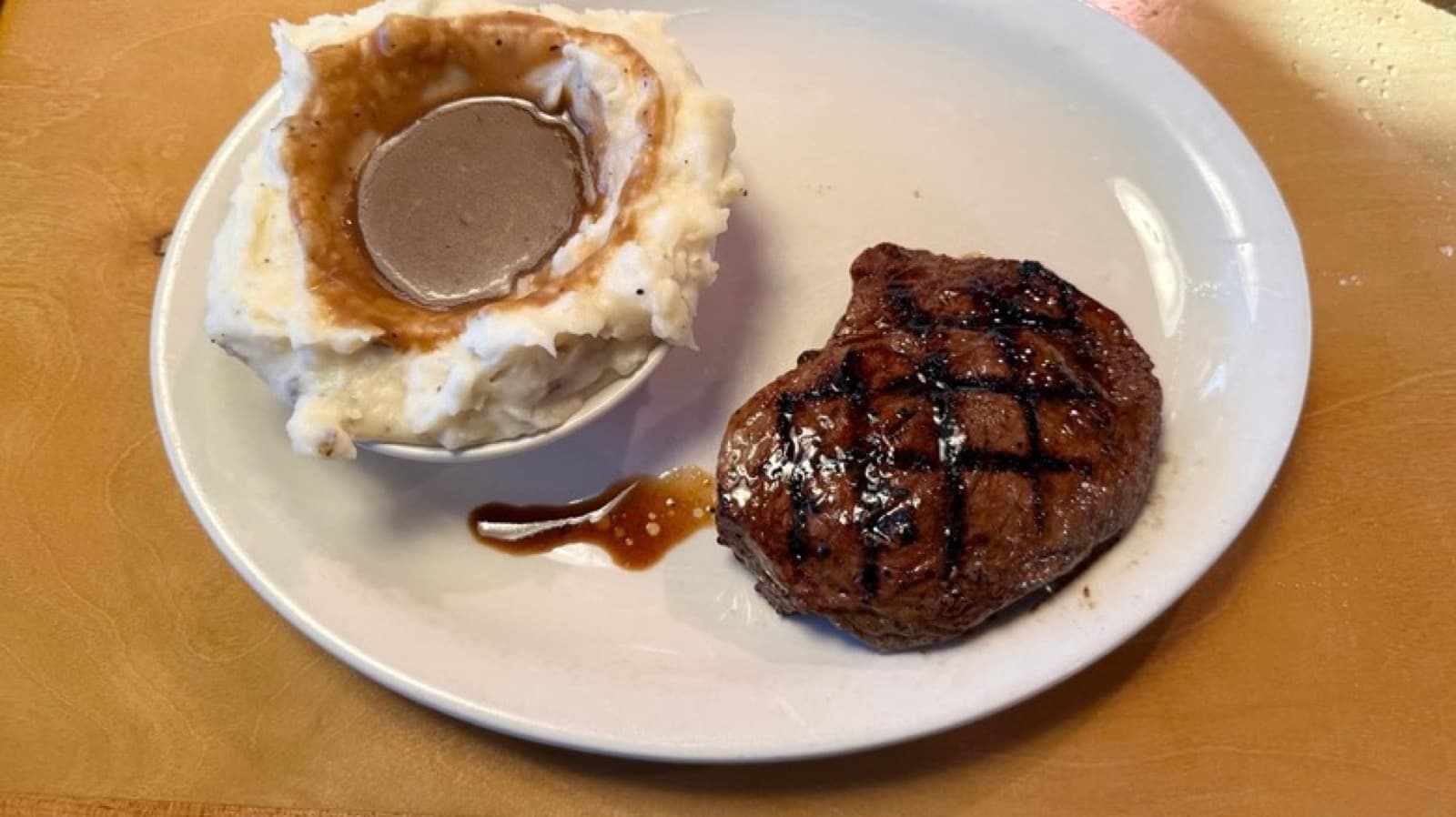 A Texas Roadhouse hand-cut steak dinner with sides