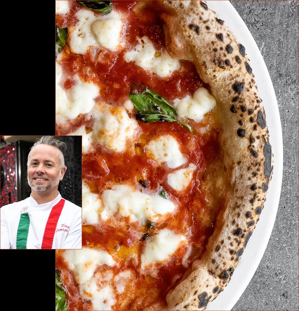 Margherita pizza with charred crust, fresh basil and fior di latte